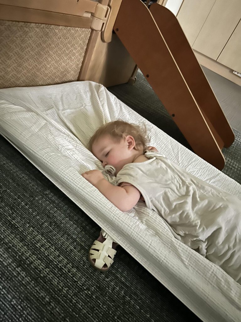 child sleeping on a cot at daycare